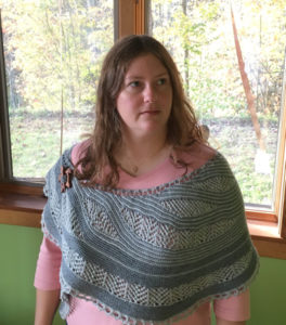 Sarah wearing a shawl she designed and created.