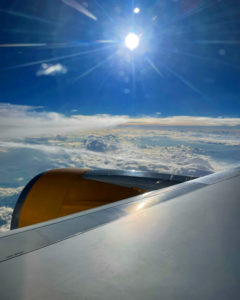 View outside plane with sun